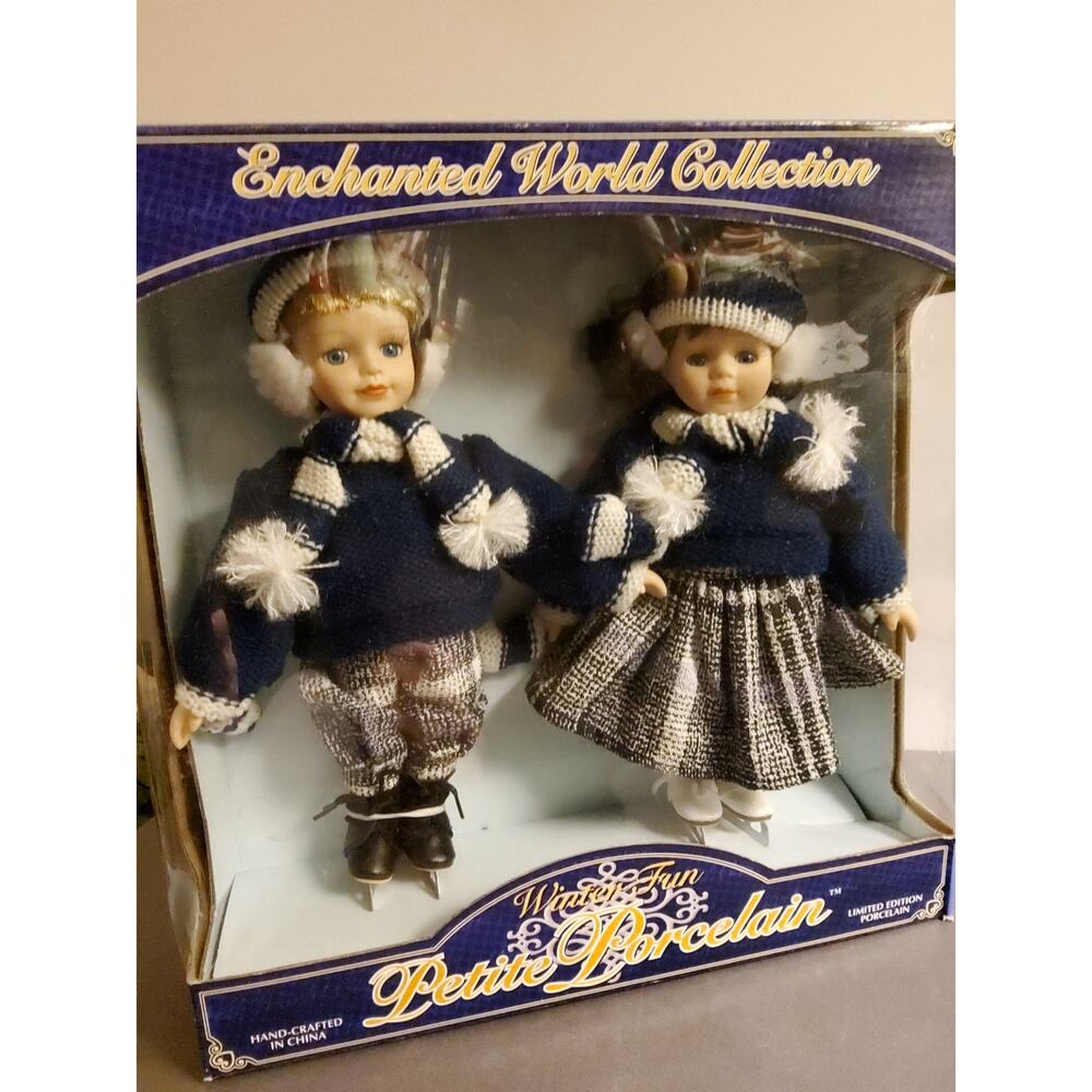 Winter Fun Porcelain Boy and Girl Dolls.
Enchanted World Collection 
NEW IN BOX